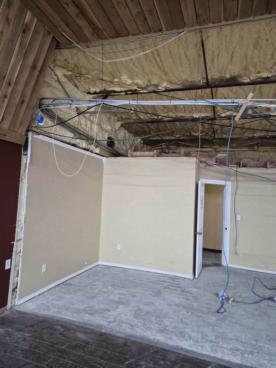 Commercial building interior with walls and ceiling stripped back
