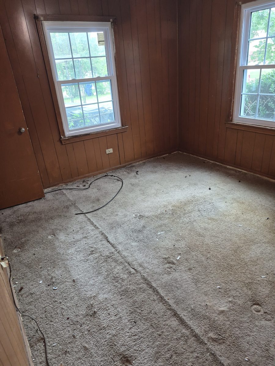Room stripped to bare concrete floor