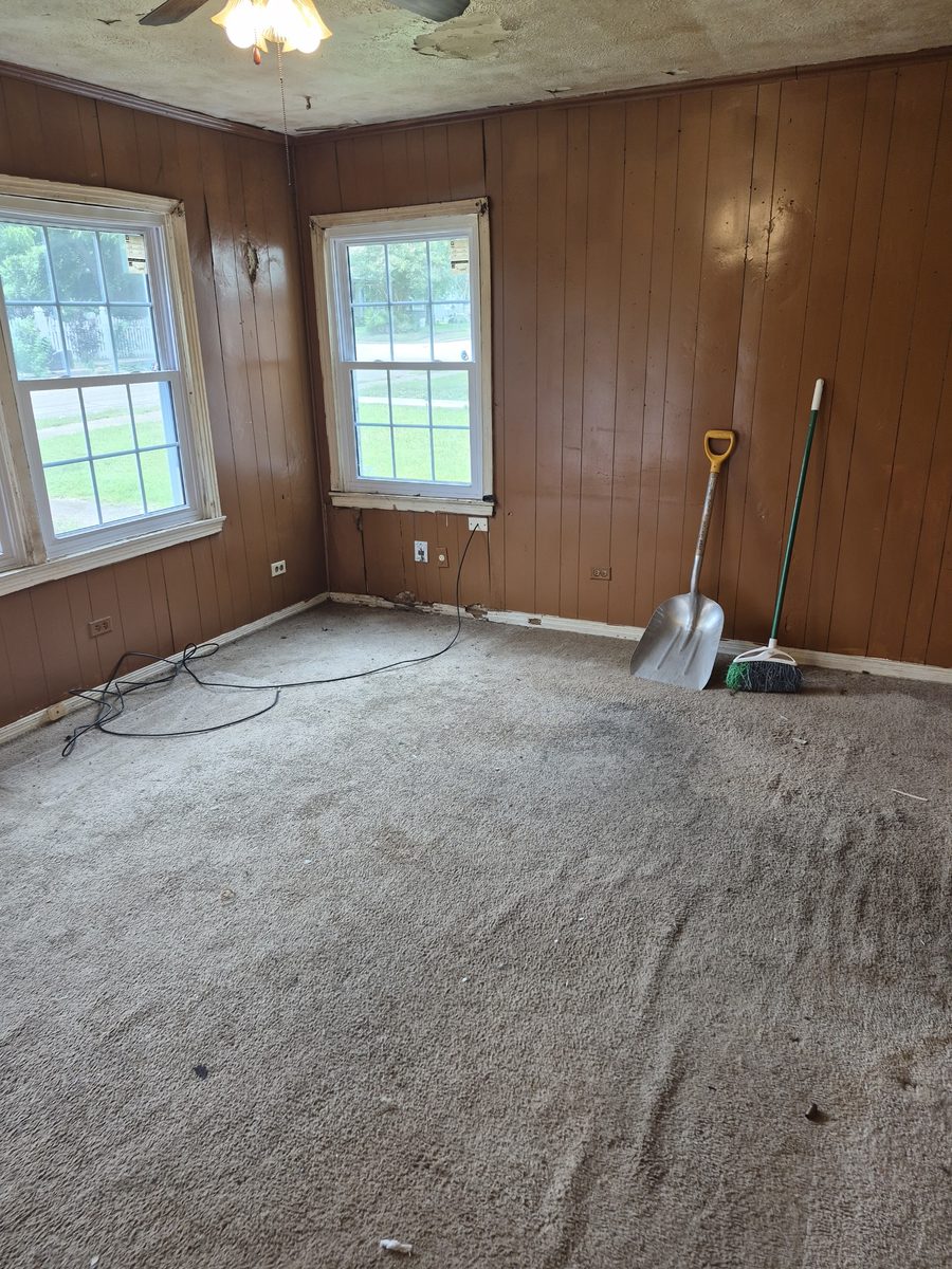 Cleared room with tools set aside at the end of a demo day