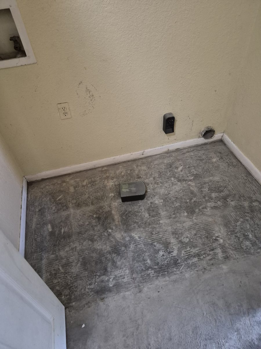 Room with flooring removed and the slab exposed
